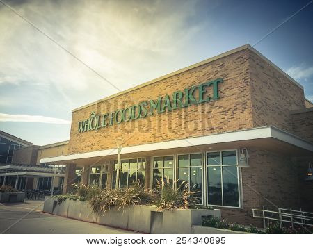 Close-up Logo Of Whole Foods Market At Store Entrance Facade