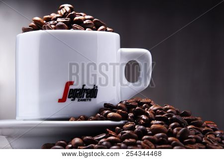 Composition With Cup And Beans Of Segafredo Zanetti Coffee