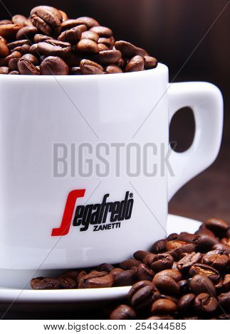 Composition With Cup And Beans Of Segafredo Zanetti Coffee