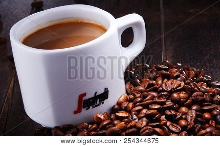 Composition With Cup And Beans Of Segafredo Zanetti Coffee