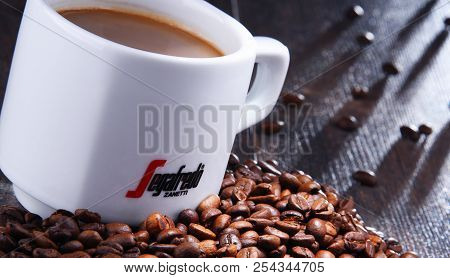 Composition With Cup And Beans Of Segafredo Zanetti Coffee