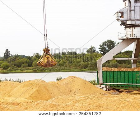 Port Cargo Crane Loads Wood Chips Into Railway Cars, Kindling-wood