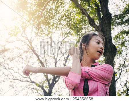 Close Up Of A Young Woman Warm Up Her Body By Stretching Her Arms To Be Ready For Exercising And Do 