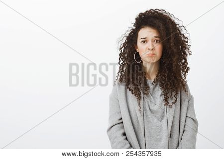 Girl Feels Regret Missing Interesting Movie In Cinema. Sulking Sad Attractive Curly-haired Female In