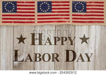 Happy Labor Day Greeting, Usa Patriotic Old Flag On A Weathered Wood Background With Text Happy Labo