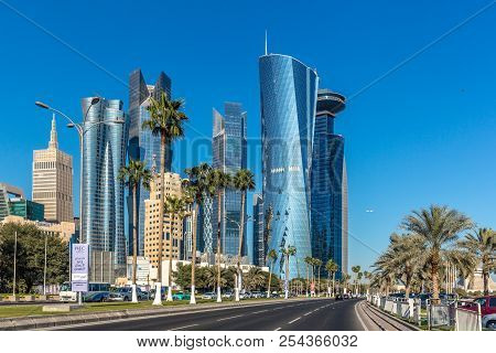 Doha, Qatar - Jan 8th 2018 - The Modern Downtown Of Doha City With Palm Tree And Cars With Wide Aven