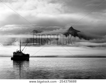 Boat At Rest Surrounded By Sunrise