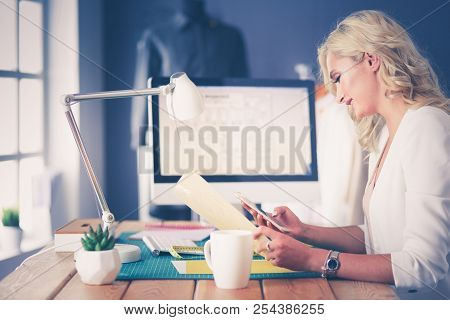 Fashion Designer Woman Working On Her Designs In The Studio.