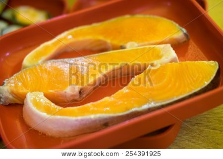 Raw Salmon Fish Fillet On Red Tray