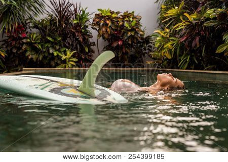 Beautiful Cute Woman In Sexy Bikini Relax In Pool With Her Longboard Single Fin Surfing Board Under 