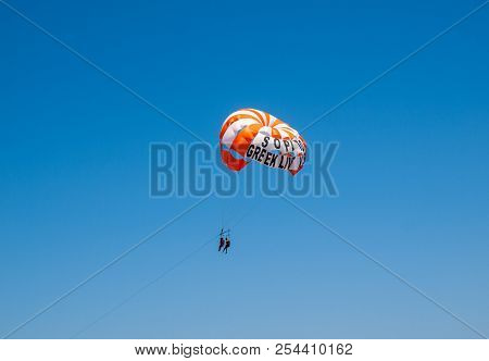 Malia. Crete, Greece - July 2, 2018:  Tourists On A Parachute Above The  Beach In Malia. Crete, Gree