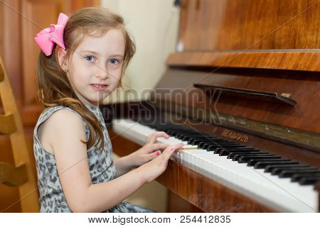 Belarus, Gomel, May 29, 2018. The Kindergarten Is Central. Open Day.child Plays The Piano.preschool 