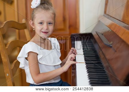 Belarus, Gomel, May 29, 2018. The Kindergarten Is Central. Open Day.child Plays The Piano.preschool 