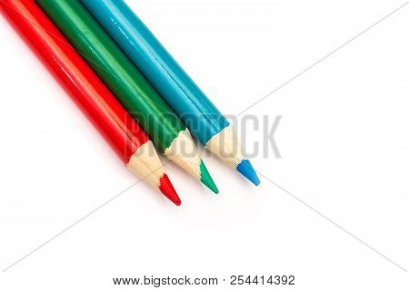 Three Colored Pencils. The Colors Red, Green And Blue. The Concept Of Polygraphy And Digital Rgb Col