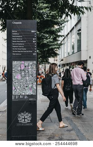 London, Uk - July 24, 2018: People Walk Past Directions And Map Board On Cheapside, City Of London, 