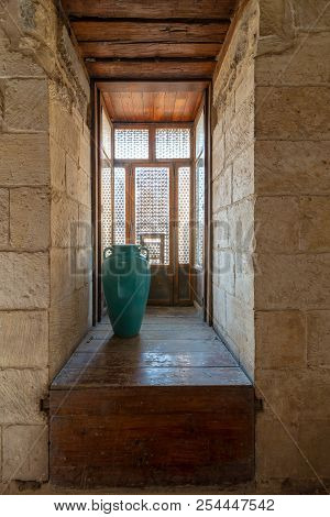 Cairo, Egypt - August 11 2018: Recessed Interleaved Wooden Window (mashrabiya) And Turquoise Vase, B