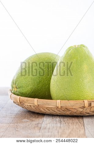 Fresh And Peeled Pomelo(shaddock), Grapefruit With Slices On Wooden Table Background