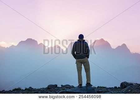 Wanderlust time. Man hiking in beautiful Fann mountains in Pamir, Tajikistan. Central Asia.