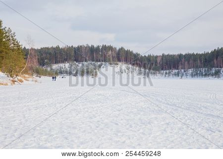 City Ogre, Latvia. Peoples And Old Sand Quarry At City Ogre. Snow And Ice, Nature Photo. Travel Phot