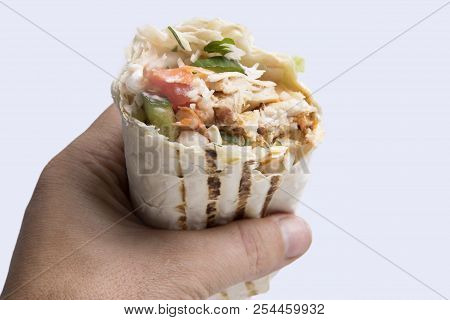 Shaverma In Hand On White Background. Doner Kebab. Delicious Juicy Shawarma