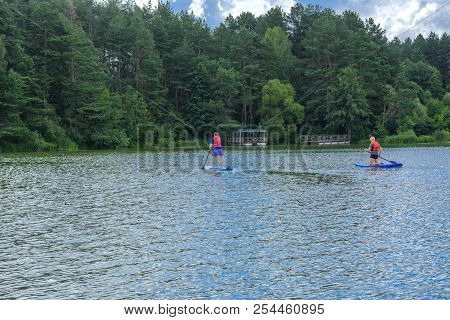 Zhytomyr, Ukraine - July 16, 2018. Athletes Conduct Training On High-speed Swimming Kayak (kayaking)