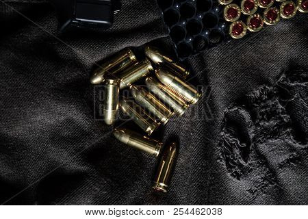 Full Metal Jacket 9Mm Ruger Bullet On Cloth Texture