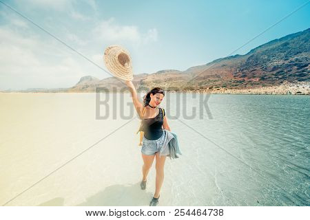 Summer Lifestyle Portrait Of Pretty Happy Girl With Tanned Sexy Body, Wearing Strawhat, Smiling And 