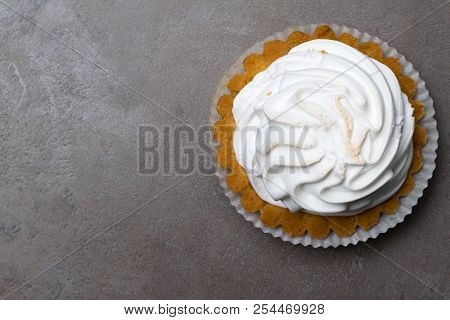 Delicious Merengue Dessert. Lemon Tartlet Tart With With Meringue On Grey Stone Concrete Table Backg