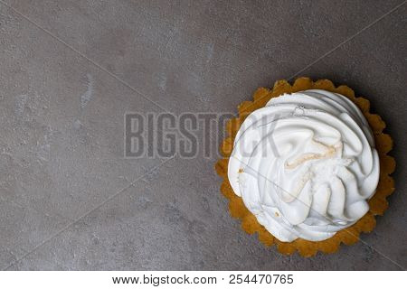 Delicious Merengue Dessert. Lemon Tartlet Tart With With Meringue On Grey Stone Concrete Table Backg