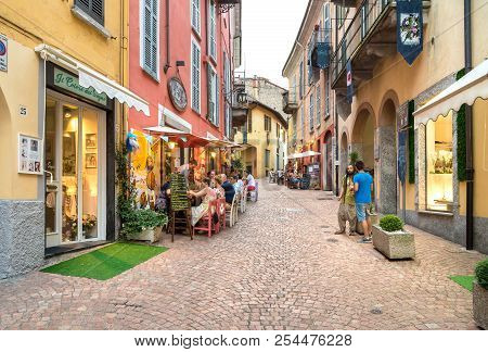 Luino, Lombardy, Italy - July 18, 2018: People Enjoying The Typical Italian Street Bars And Restaura