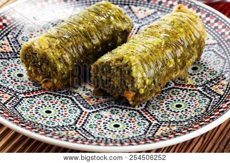 Turkish Dessert Fıstık Ezmesi Baklava With Pistachio On Wooden Table.