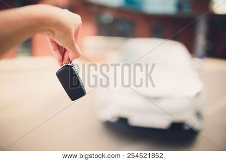 In Selective Focus Of Hand Presses On Remote Control Car Alarm Systems.cross Processing And Split To