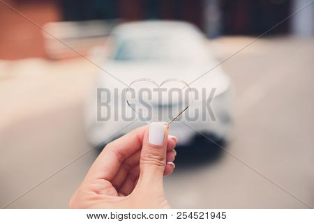In Selective Focus Of Hand Presses On Remote Control Car Alarm Systems.cross Processing And Split To