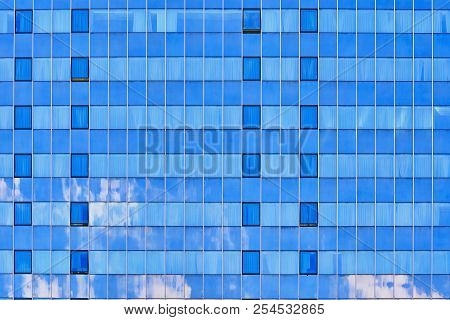 Glass Facade With Sky Refkection Of High-rise Building