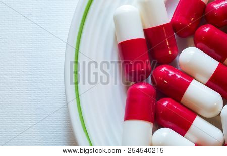 Macro Photo Shot Close-up Of Capsule Medicine White Red Color