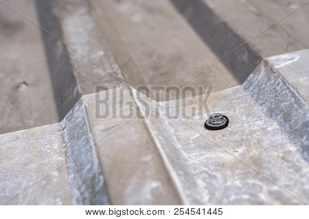 Gray Corrugated Metal Cladding On Industrial Building Roof