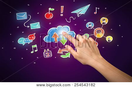 Female hand toucing mixed media icons with purple background