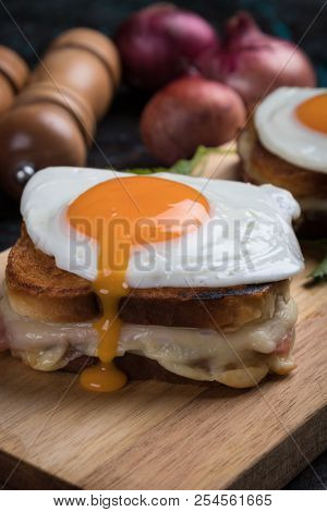 French croque madame sandwich with ham, cheese and fried egg