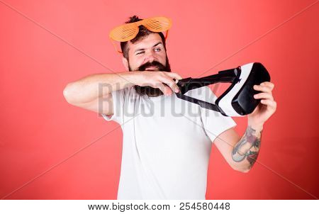 Man Bearded Hipster With Virtual Reality Headset And Louvered Sunglasses Red Background. Alternative
