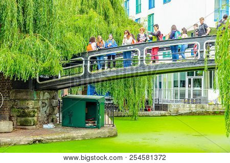 London, Uk - September 1, 2017 - Tourists Crossing The Camden Lock Footbridge Above Regents Canal Co