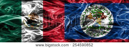Mexico Vs Belize Smoke Flags Placed Side By Side. Mexican And Belize Flag Together