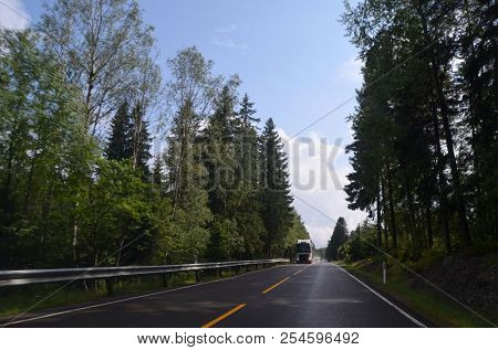 A typical Norwegian road in the countryside. June 16. 2018. Ostfold Region, Norway