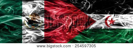 Mexico Vs Sahrawi Smoke Flags Placed Side By Side. Mexican And Sahrawi Flag Together