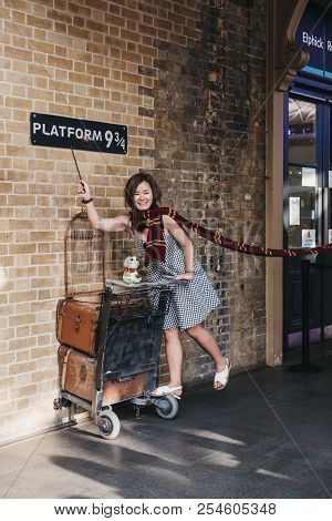 London, Uk - July 26, 2018: People Taking Photos By 9 3/4 Platform Inside Kings Cross Station, Londo