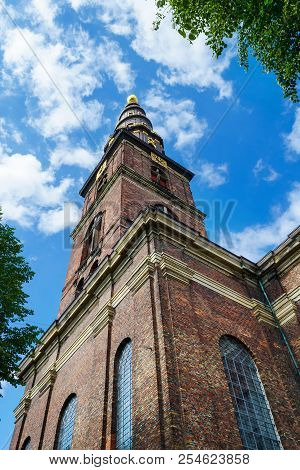 Beautiful Church Of Our Savior. Copenhagen, Denmark, Against The Blue Sky. Bottom View. Architecture