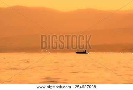 Kayak Sailing At Sunset