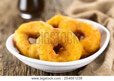 Traditional Chilean Picarones Fried Pastries Made Of Pumpkin And Flour Yeast Dough, Sweet Chancaca C
