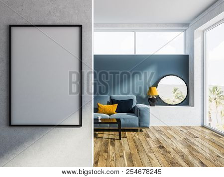 Modern Living Room Interior With Blue Walls, A Wooden Floor And A Blue Sofa Near A Coffe Table. A Ve