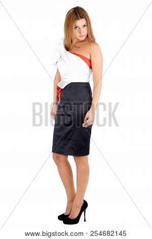 Side View Of A Beautiful Young Woman In Black And White Dress Standing Three-quarter And Looking At 