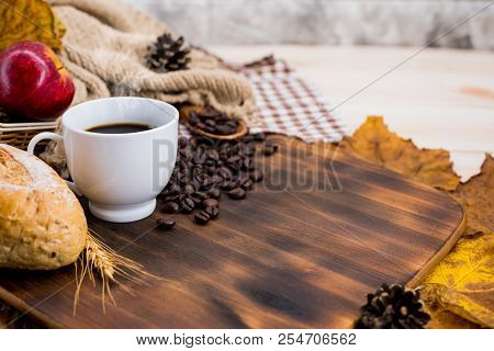Cup Of Hot Coffee With Toast For Autumn Season Warm Drink. Fall Harvest Cornucopia. Copy Space On Wo